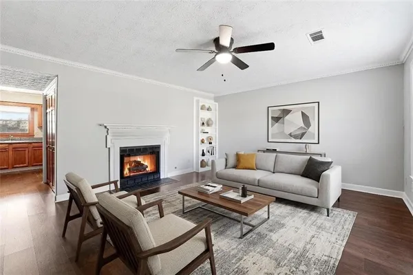a living room with furniture and a fireplace