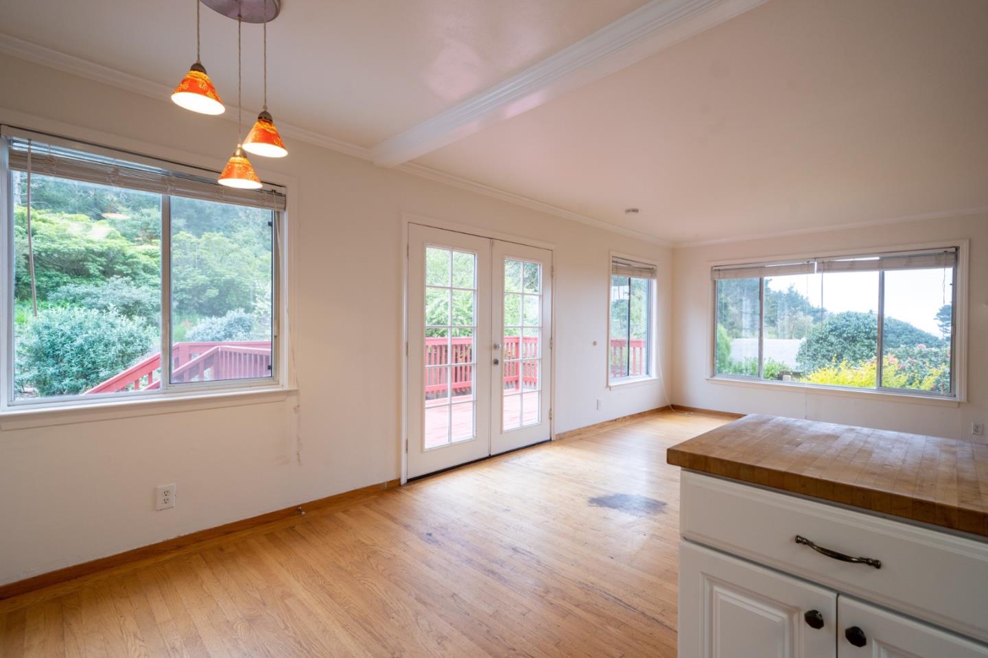 616 Brighton Road Pacifica, CA 94044 - Photo 4 of 14 an empty room with wooden floor and windows