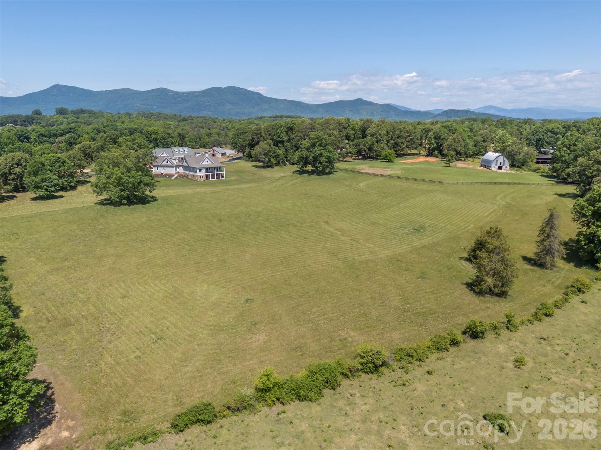 297 Mountain Meadows Lane, Unit 7 Tryon, NC 28782 - Photo 47 of 47 a view of a lake with a mountain