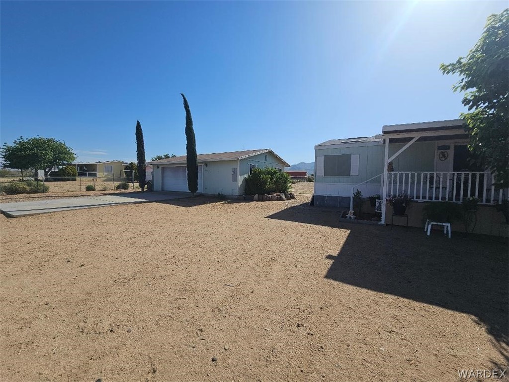 3552 Adobe Road Golden Valley, AZ 86413 - Photo 3 of 15 a view of a house with outdoor space