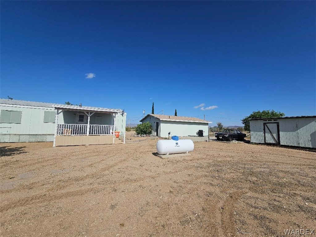 3552 Adobe Road Golden Valley, AZ 86413 - Photo 6 of 15 a large house with a outdoor space