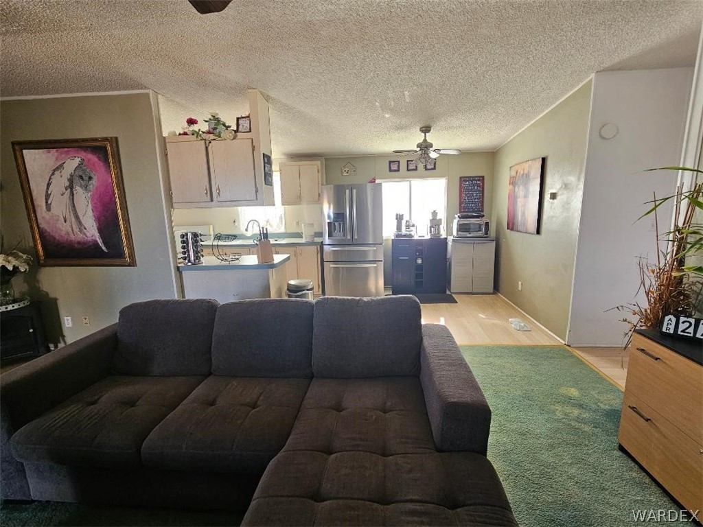 3552 Adobe Road Golden Valley, AZ 86413 - Photo 8 of 15 a living room with furniture and painting on the wall