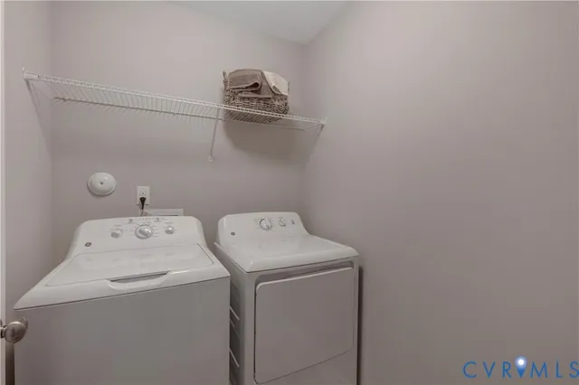 a bathroom with a sink vanity mirror and toilet