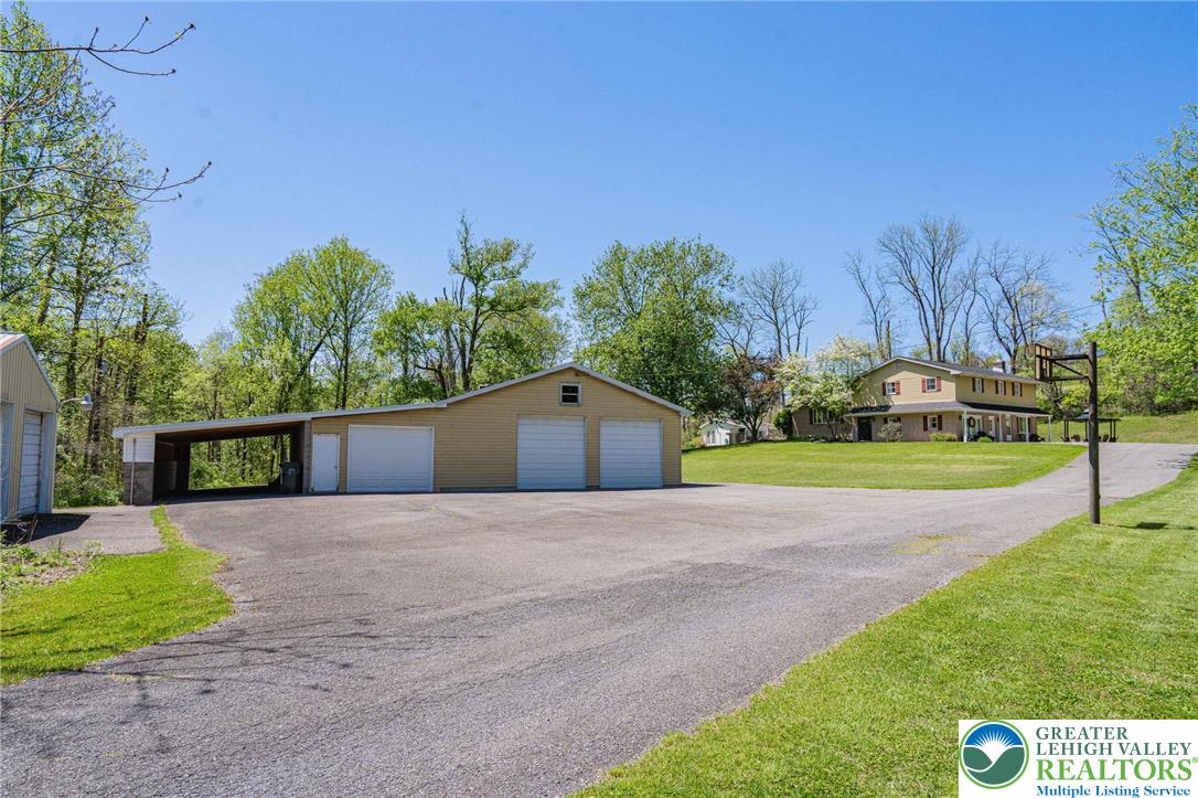 3857 Friedens Road Slatington, PA 18080 - Photo 10 of 75 This spacious property features a detached garage, offering ample storage and utility for various needs.