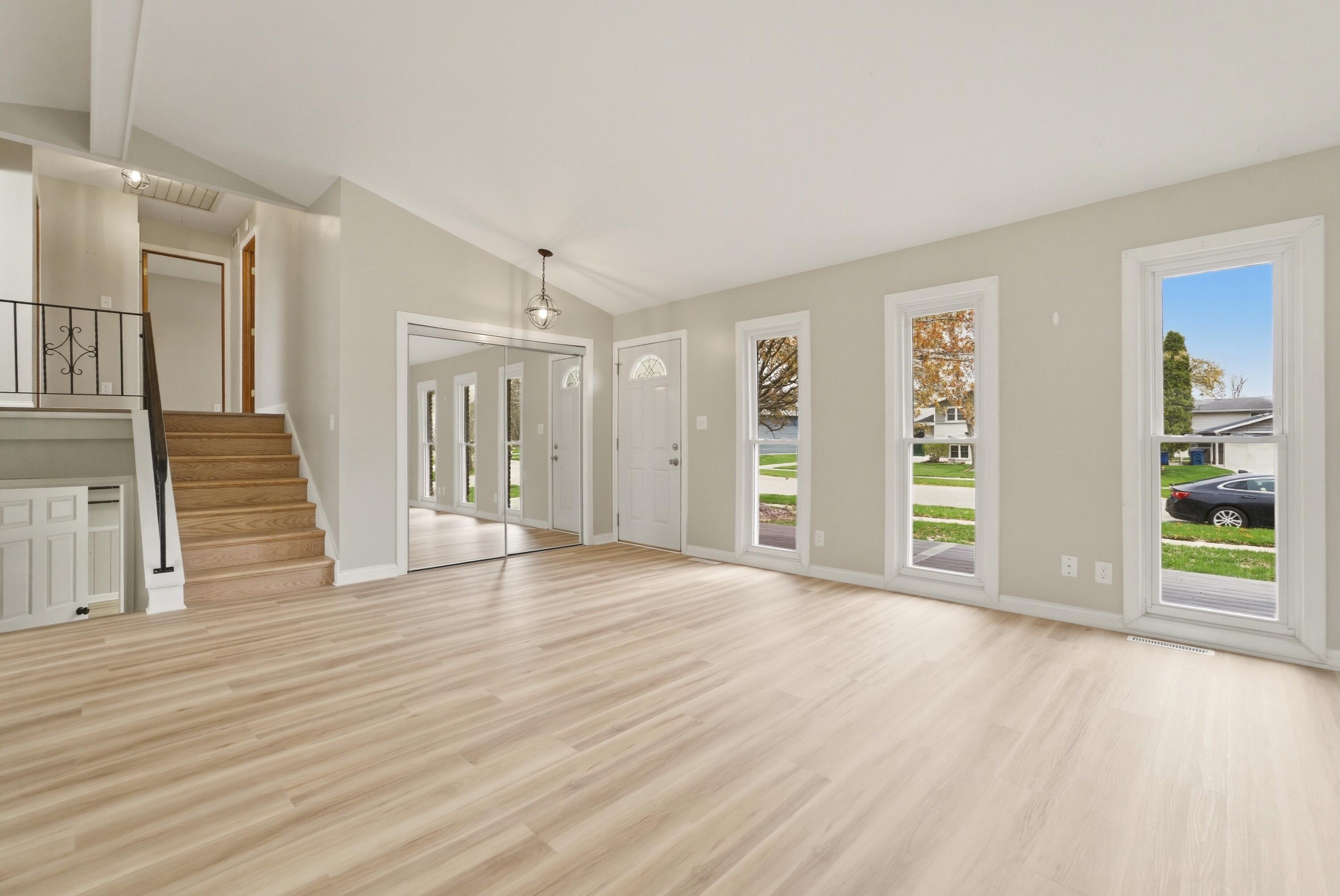 9830 Mckinley Street Crown Point, IN 46307 - Photo 11 of 25 a view of an empty room with wooden floor and a window