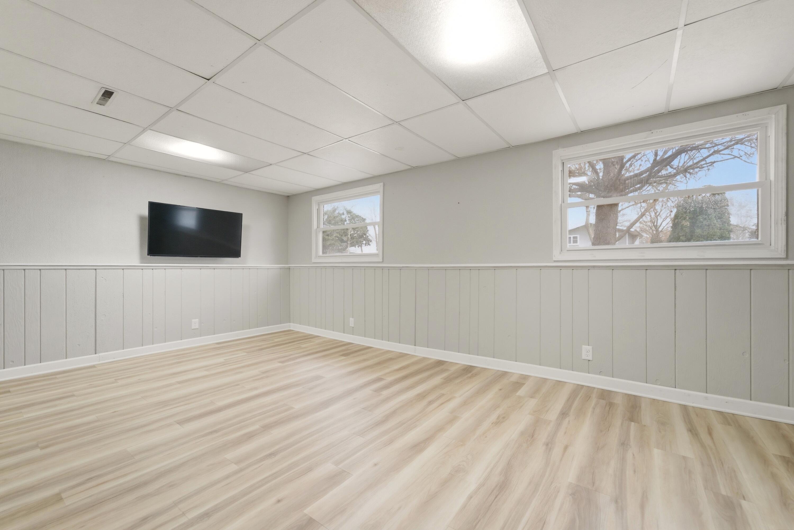 9830 Mckinley Street Crown Point, IN 46307 - Photo 12 of 25 a view of an empty room with wooden floor and a window