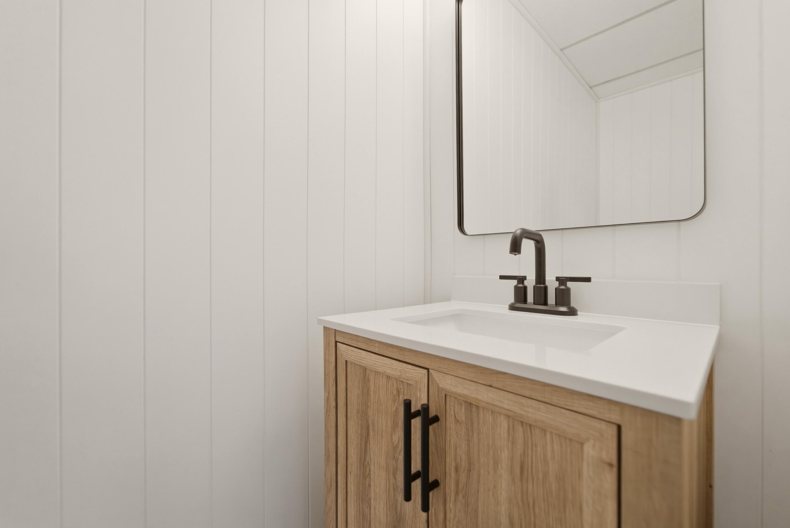 9830 Mckinley Street Crown Point, IN 46307 - Photo 13 of 25 a bathroom with a sink and a mirror
