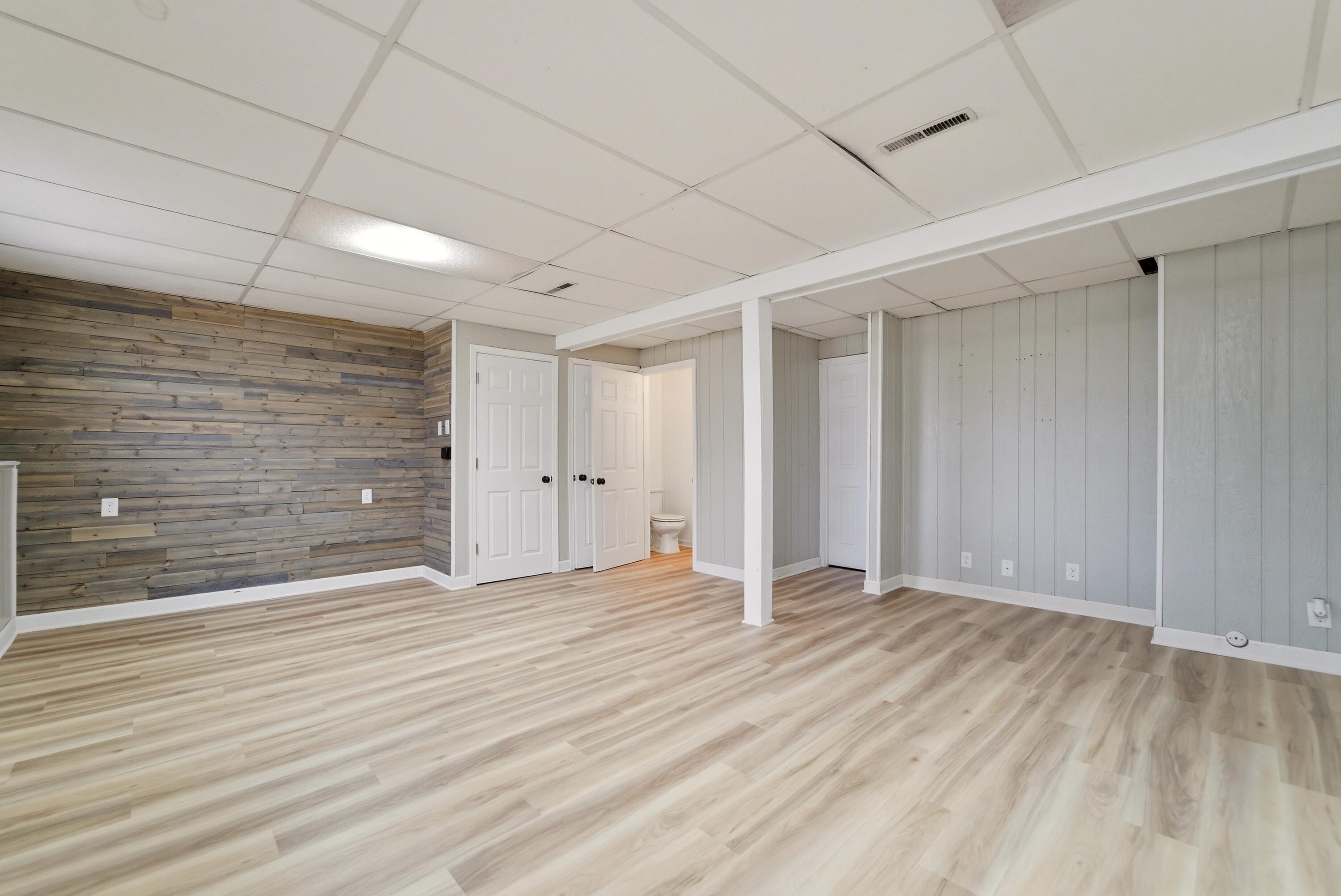 9830 Mckinley Street Crown Point, IN 46307 - Photo 14 of 25 a view of an empty room with wooden floor