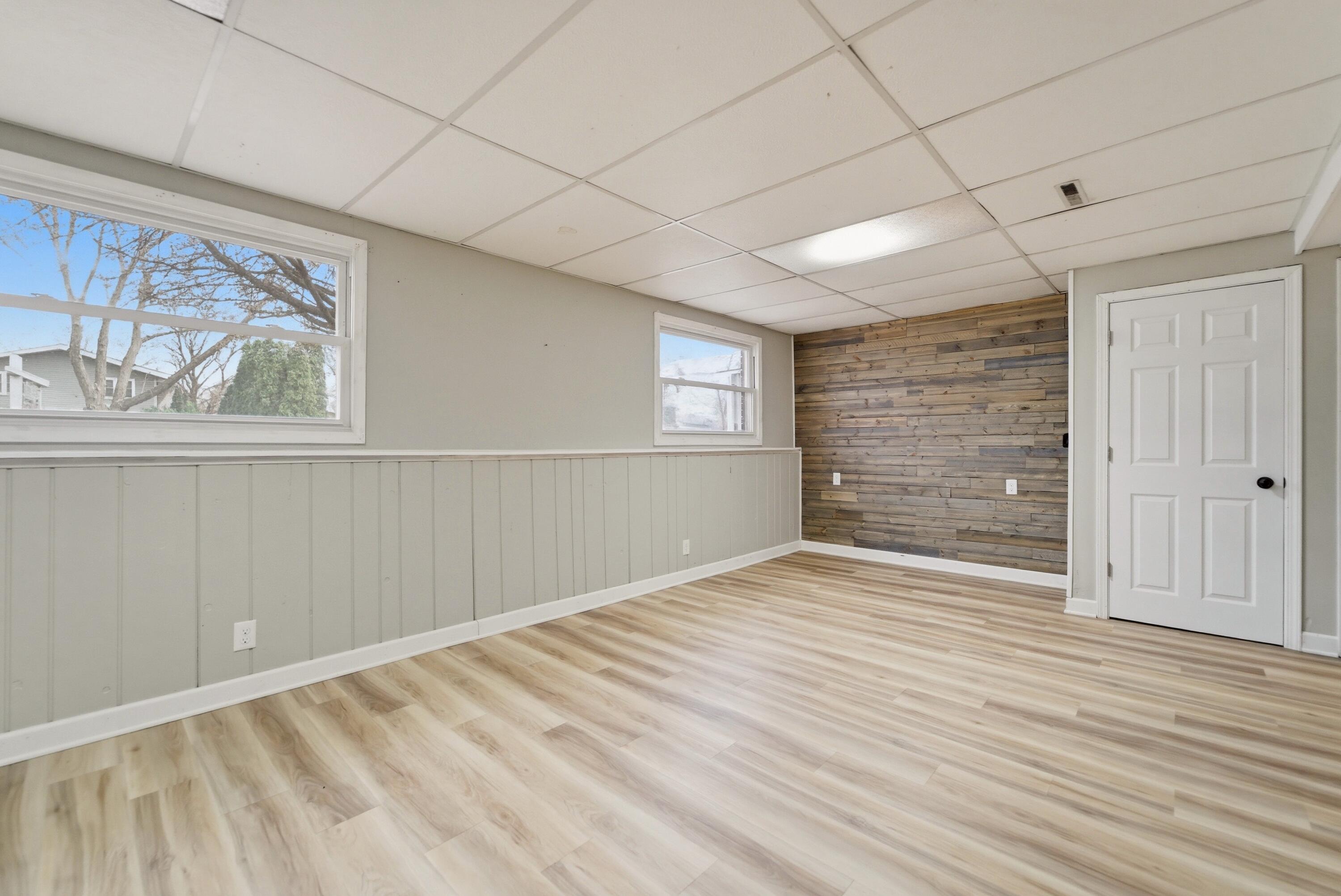 9830 Mckinley Street Crown Point, IN 46307 - Photo 15 of 25 a view of an empty room with wooden floor and a window