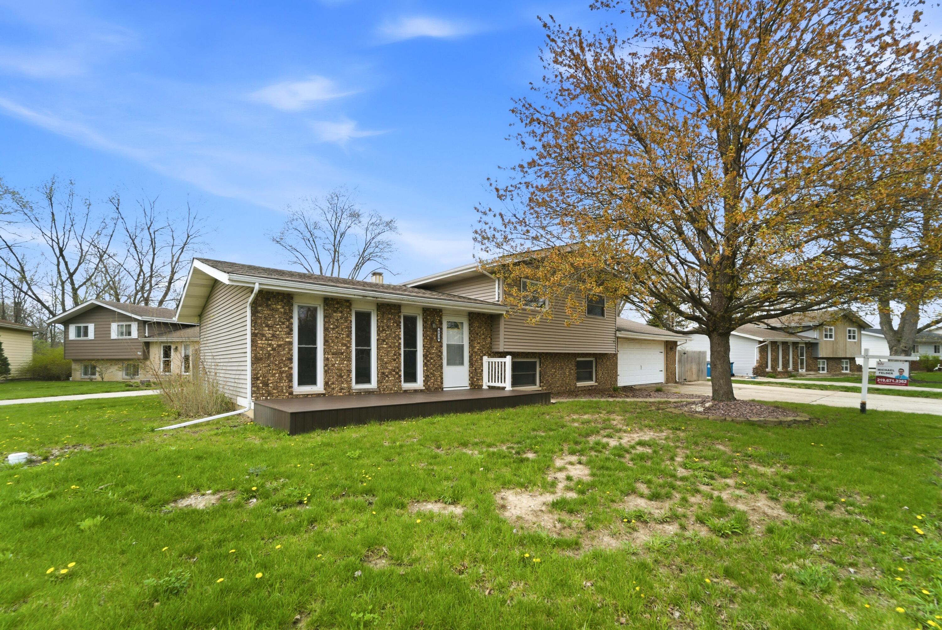 9830 Mckinley Street Crown Point, IN 46307 - Photo 2 of 25 a view of a house with a yard