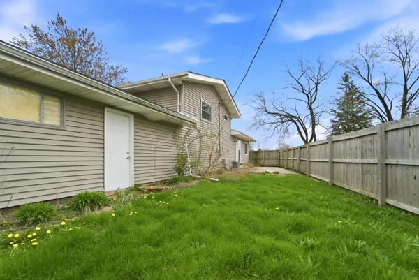 a backyard of a house with lots of green space