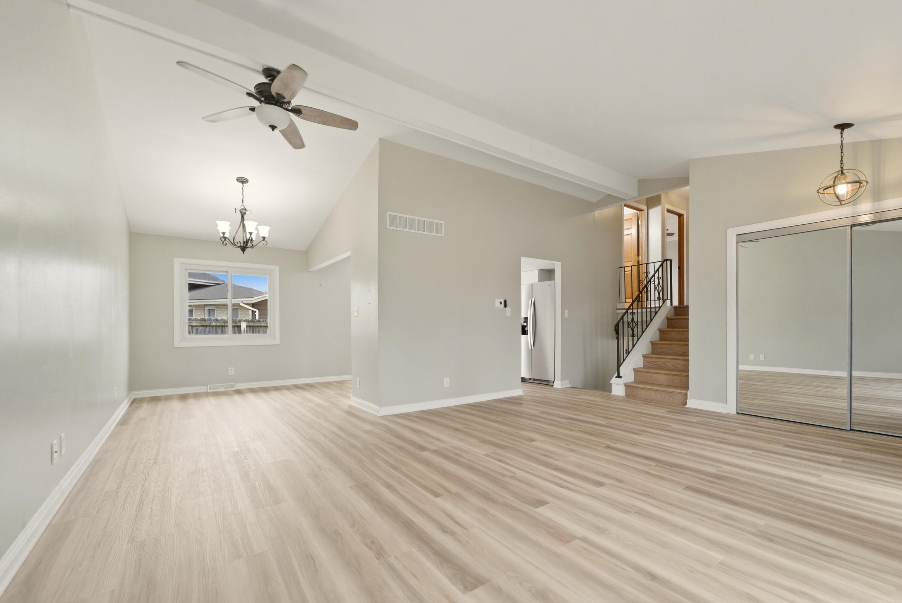 9830 Mckinley Street Crown Point, IN 46307 - Photo 5 of 25 a view of empty room with wooden floor and fan