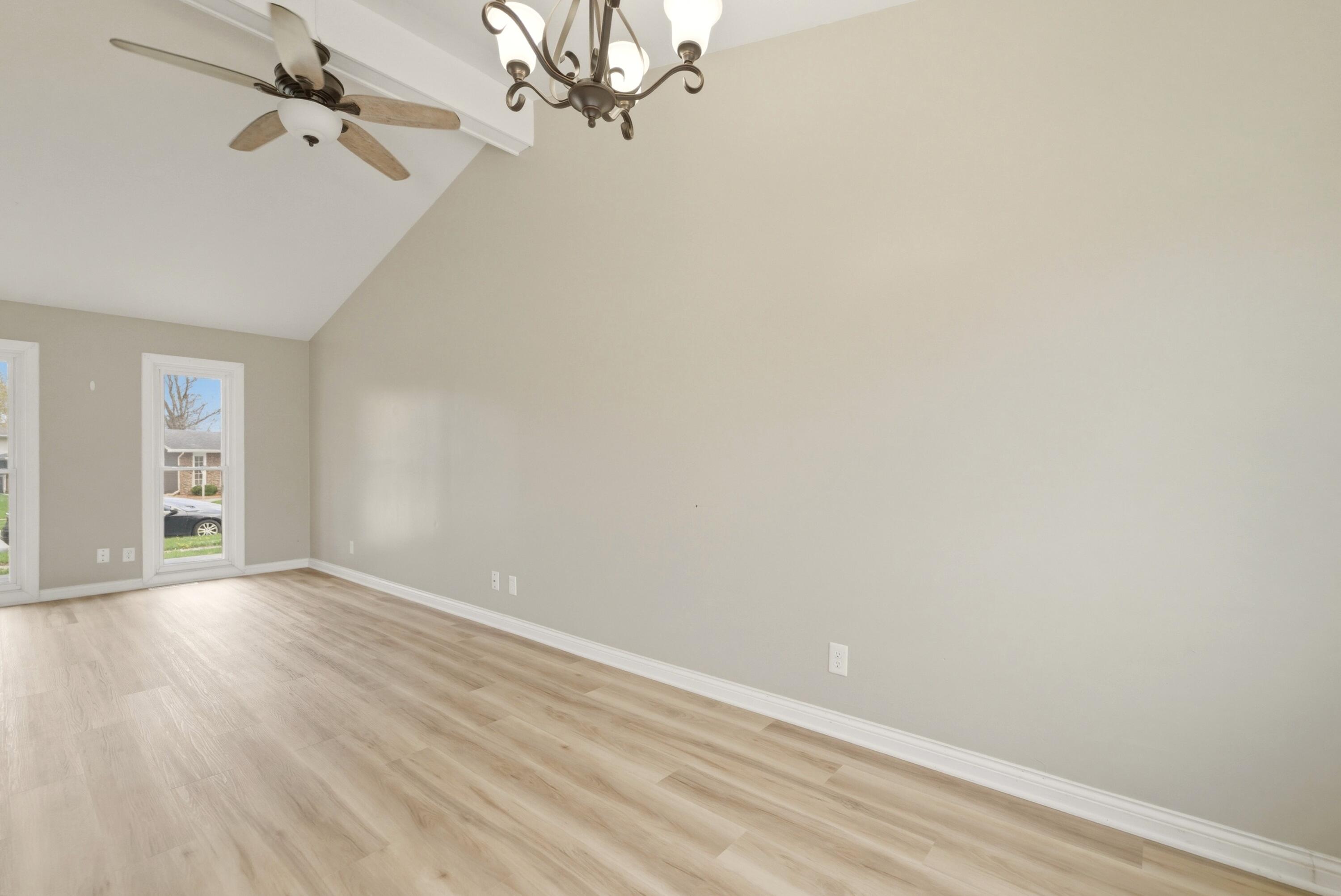 9830 Mckinley Street Crown Point, IN 46307 - Photo 6 of 25 a view of an empty room with wooden floor and a window
