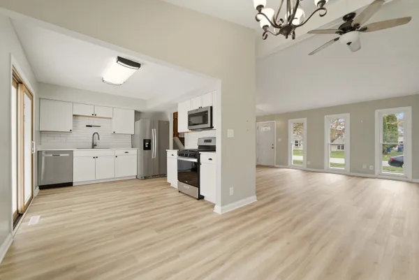 a view of a kitchen with a sink cabinets and window