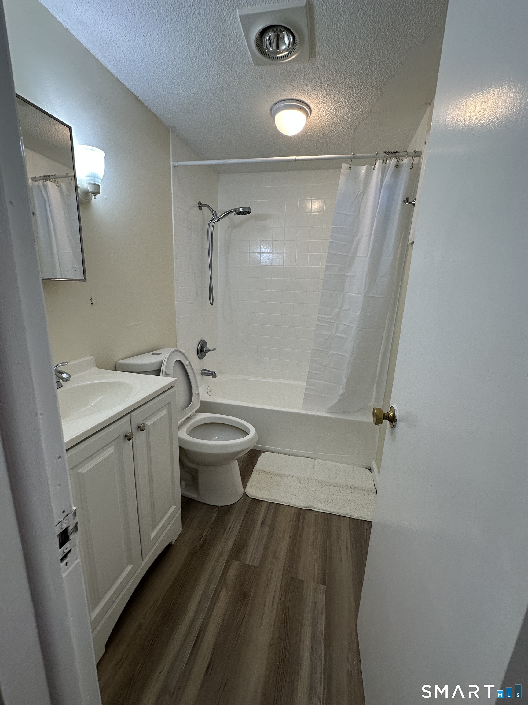 25-29 Locust Street New Britain, CT 06051 - Photo 4 of 5 a bathroom with a granite countertop sink toilet and shower