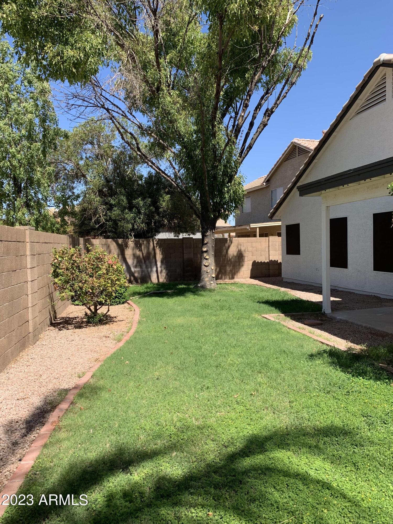 2642 South Augustine Mesa, AZ 85209 - Photo 17 of 18 a front view of house with yard and garage