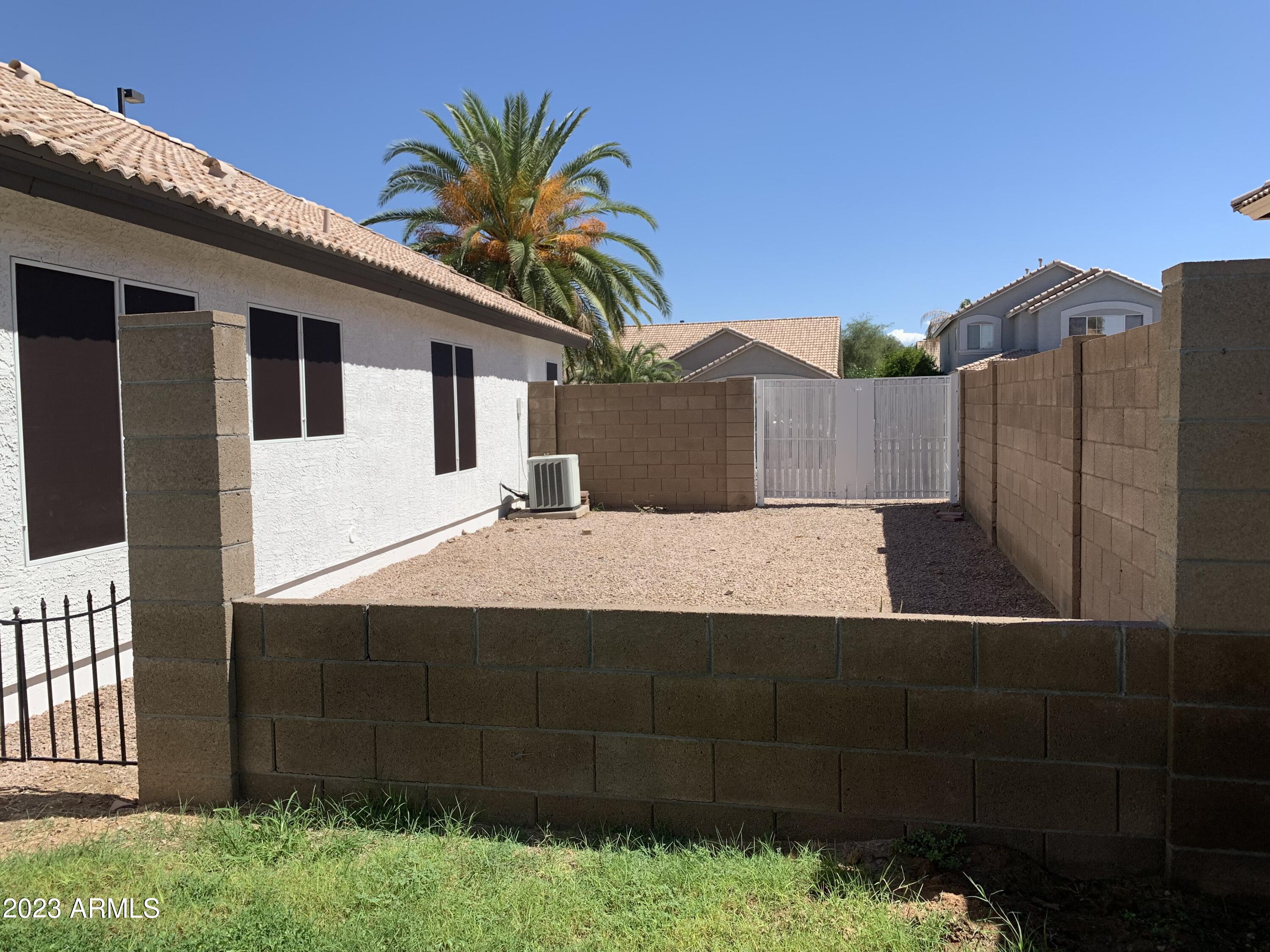 2642 South Augustine Mesa, AZ 85209 - Photo 18 of 18 a view of a house with a backyard