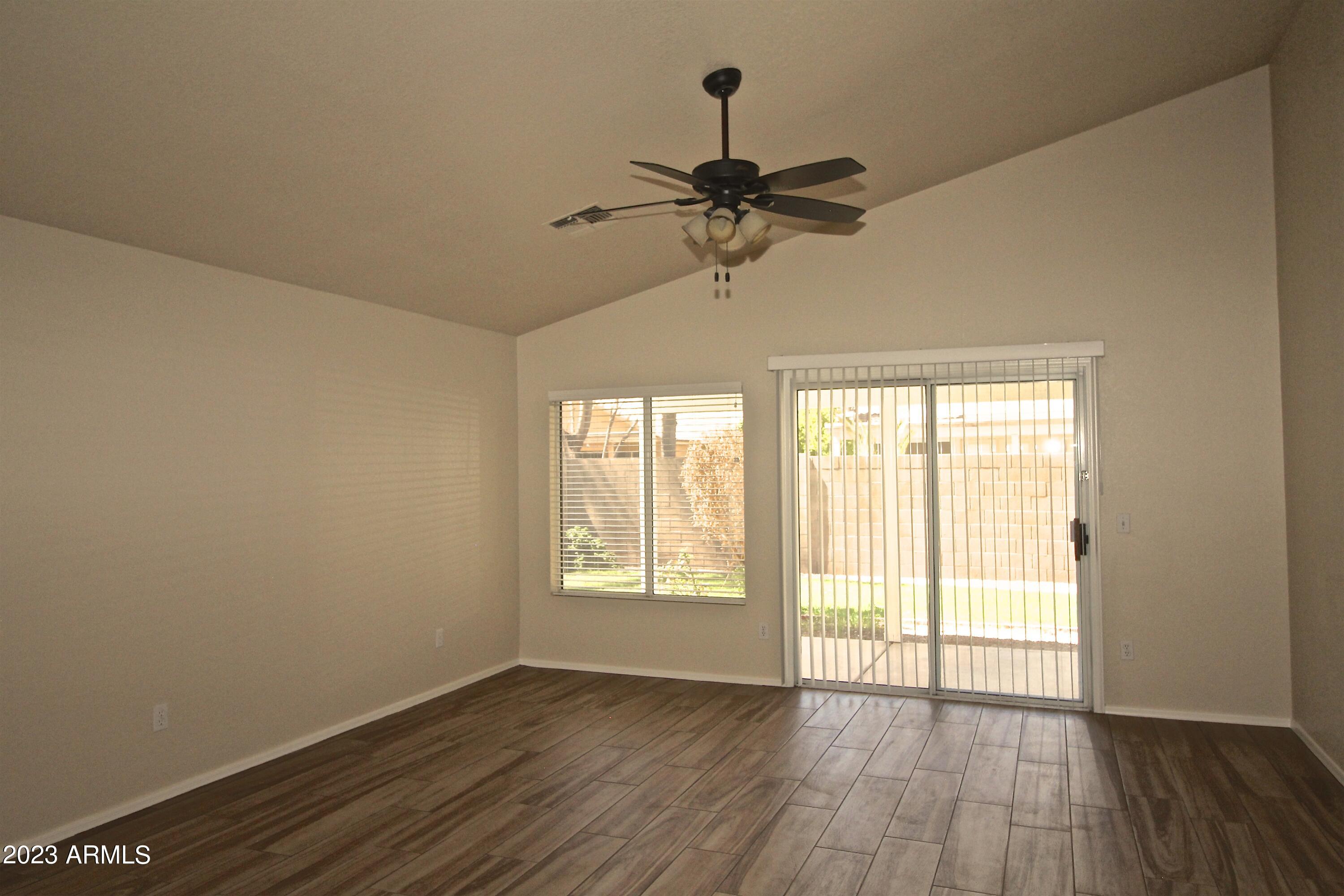 2642 South Augustine Mesa, AZ 85209 - Photo 6 of 18 a view of an empty room with wooden floor and a window