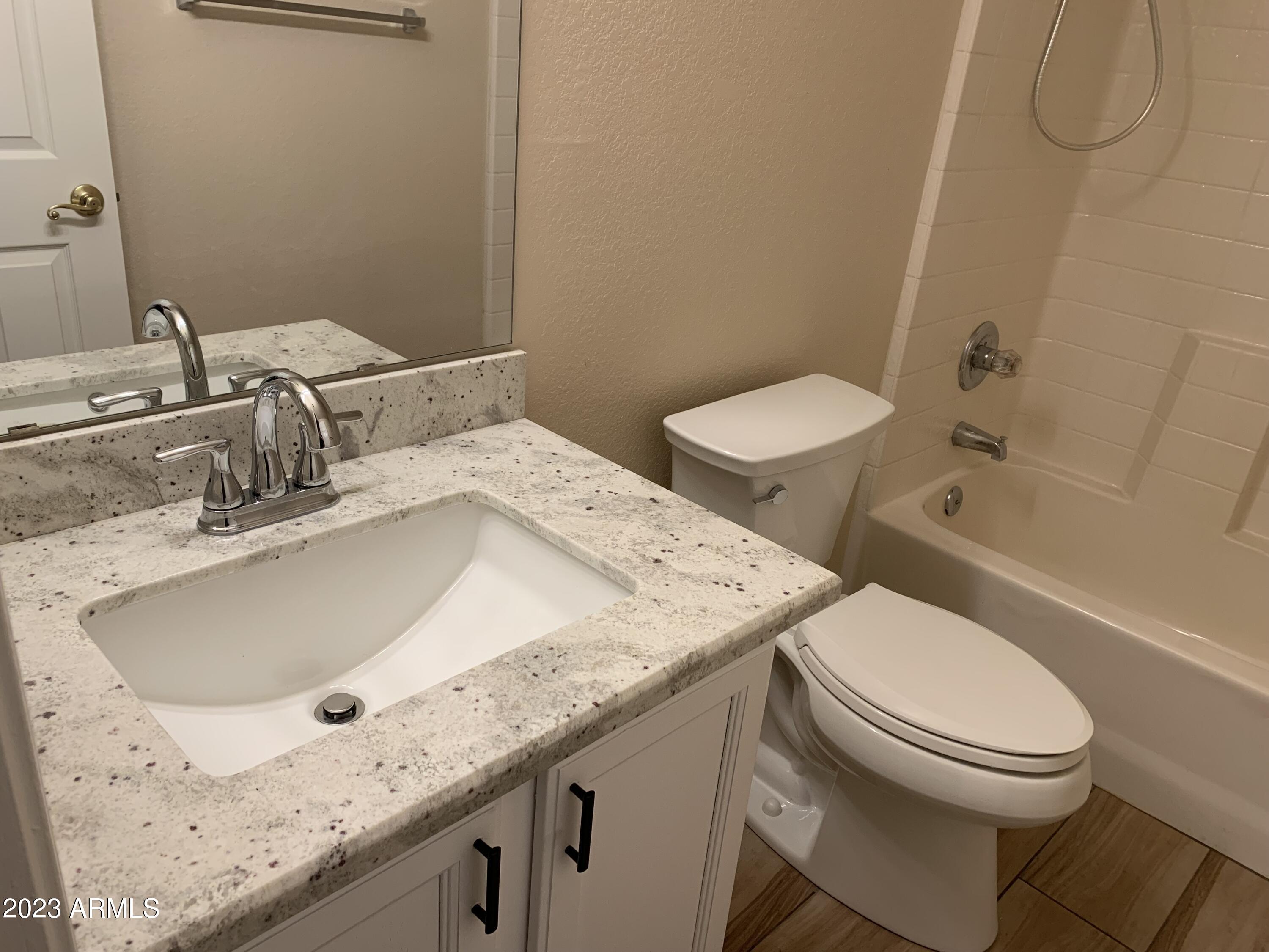 2642 South Augustine Mesa, AZ 85209 - Photo 7 of 18 a bathroom with a granite countertop sink toilet and shower
