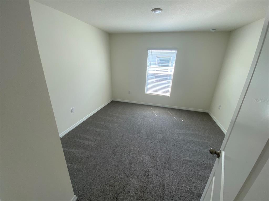8864 Southwest 49th Circle Ocala, FL 34476 - Photo 11 of 48 an empty room with windows