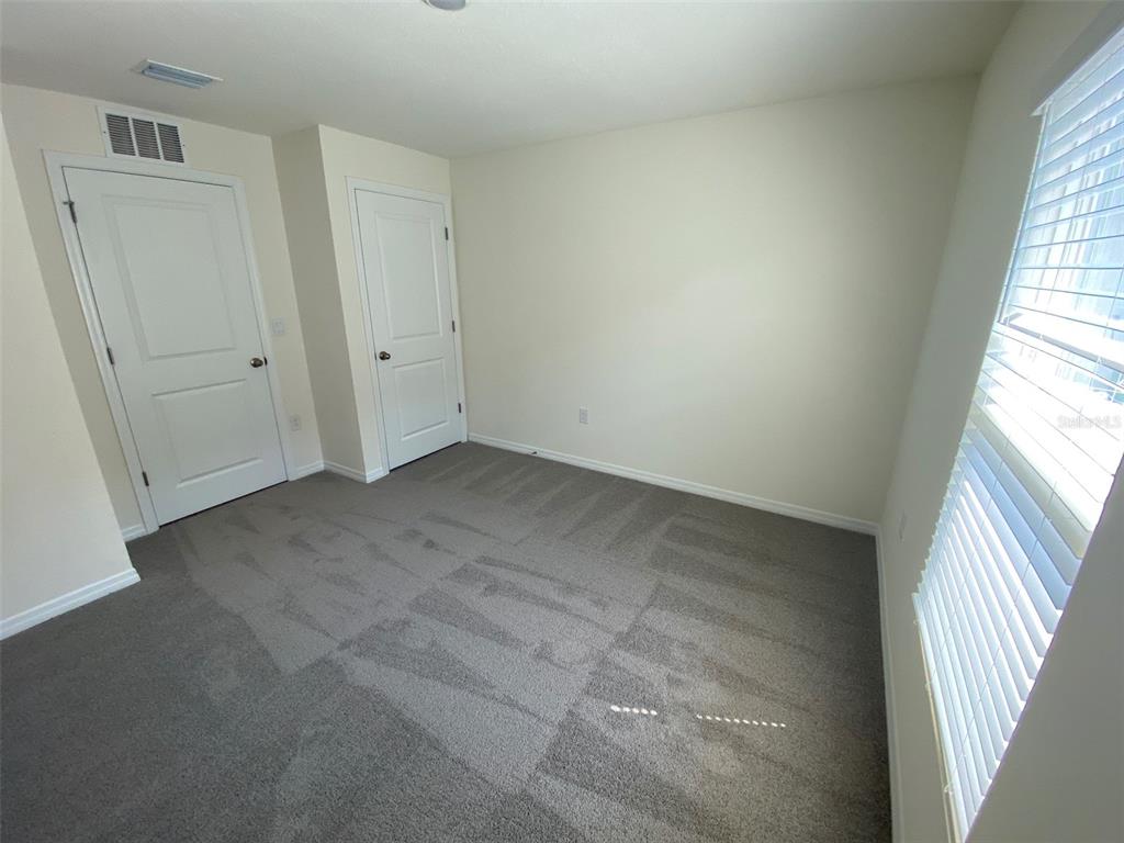8864 Southwest 49th Circle Ocala, FL 34476 - Photo 12 of 48 an empty room with windows