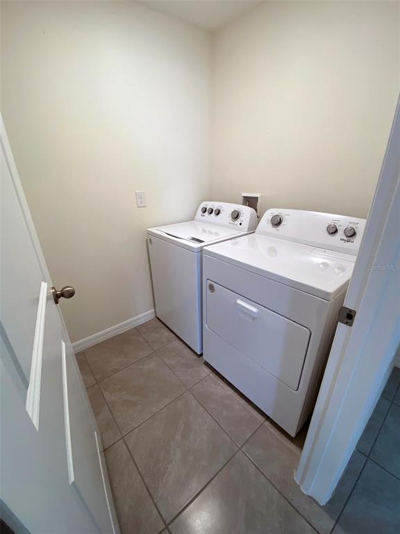 8864 Southwest 49th Circle Ocala, FL 34476 - Photo 13 of 48 a utility room with dryer and washer