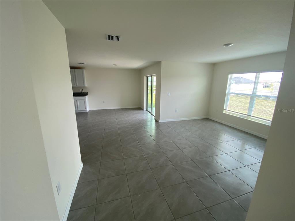 8864 Southwest 49th Circle Ocala, FL 34476 - Photo 24 of 48 an empty room with windows and entrance