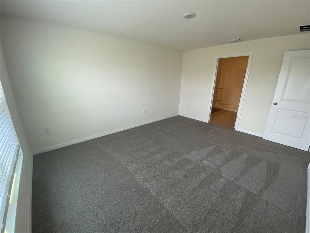 8864 Southwest 49th Circle Ocala, FL 34476 - Photo 27 of 48 an empty room with windows