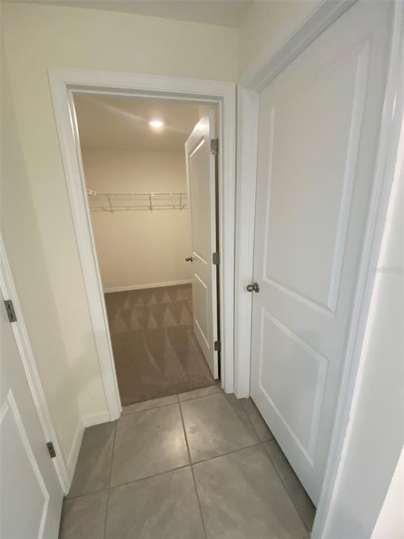 8864 Southwest 49th Circle Ocala, FL 34476 - Photo 29 of 48 an empty room with mirror and a bathroom