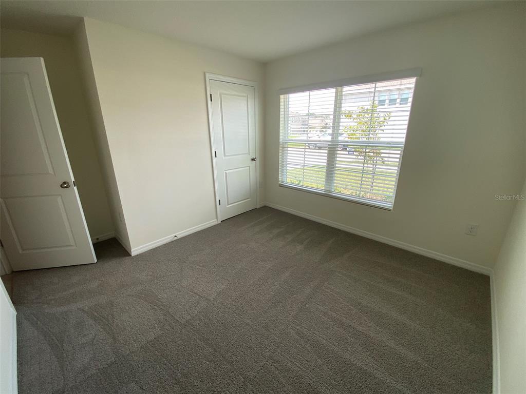 8864 Southwest 49th Circle Ocala, FL 34476 - Photo 7 of 48 an empty room with a window
