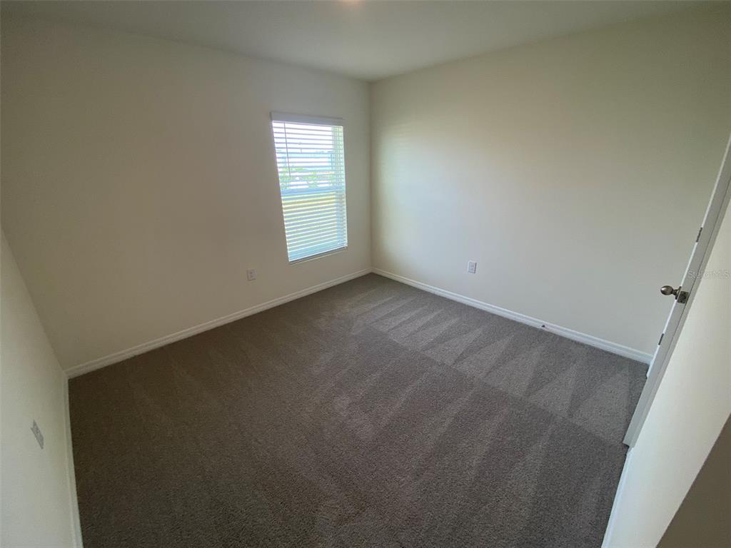 8864 Southwest 49th Circle Ocala, FL 34476 - Photo 8 of 48 an empty room with windows