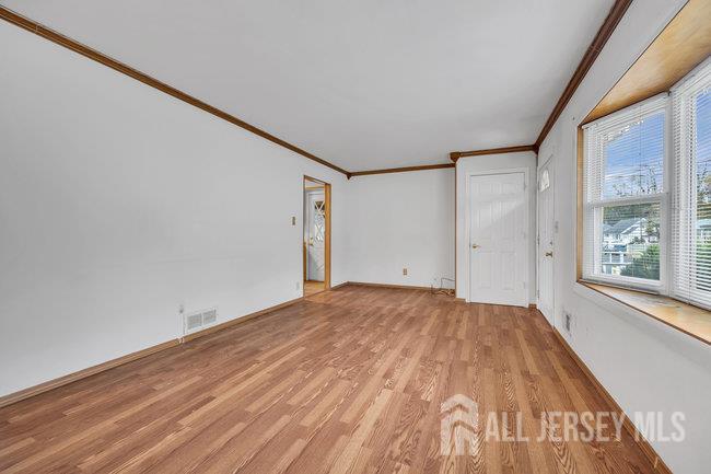 25 Venus Road Old Bridge, NJ 08879 - Photo 13 of 44 a view of a big room with wooden floor and windows