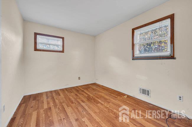 25 Venus Road Old Bridge, NJ 08879 - Photo 24 of 44 a view of a room with wooden floor and wall painting