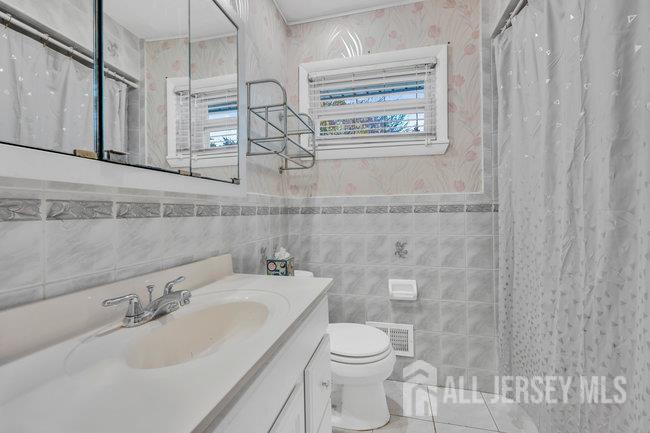 25 Venus Road Old Bridge, NJ 08879 - Photo 25 of 44 a bathroom with a sink a toilet and shower