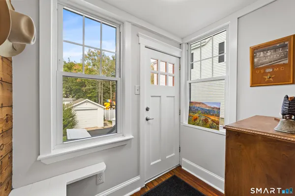 a view of a kitchen with furniture and a window