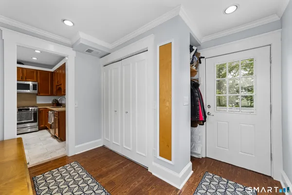 a view of a bedroom with a bed and a window