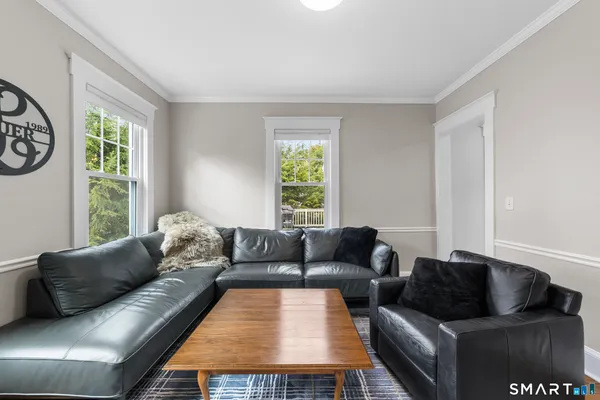 a living room with furniture and a window