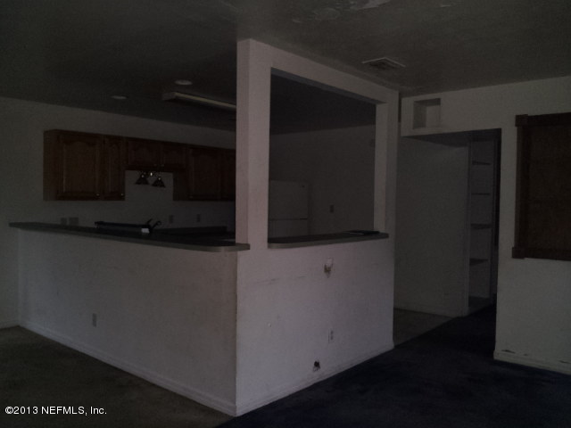 720 Bonita Road Atlantic Beach, FL 32233 - Photo 3 of 12 a microwave oven sitting on top of a refrigerator