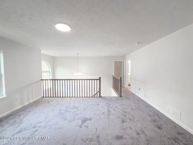 a view of a livingroom with a staircase