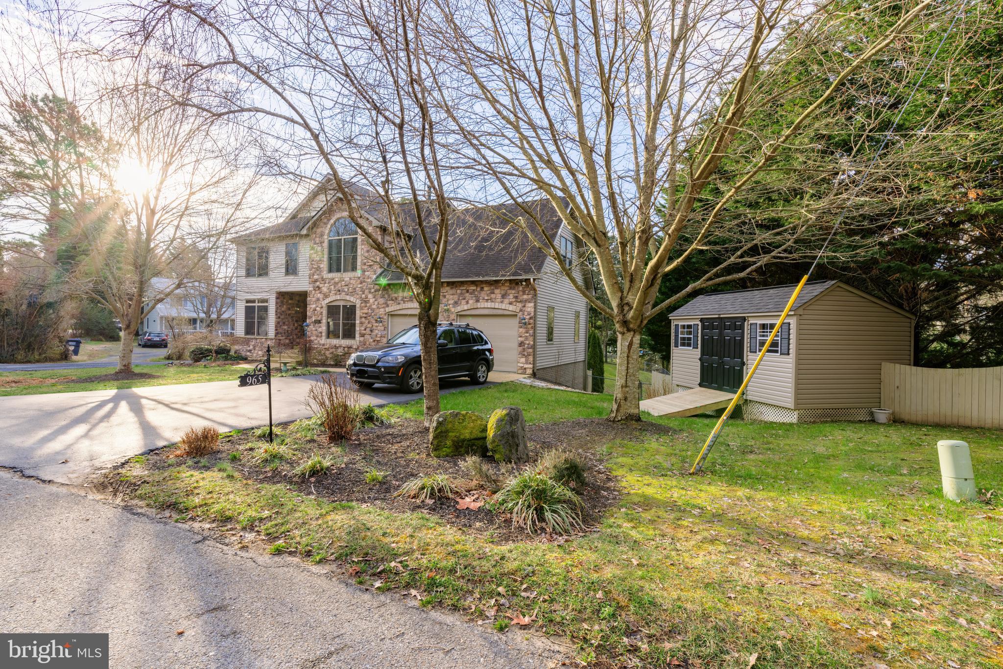 965 Curtis Road Solomons, MD 20629 - Photo 12 of 47 a view of a house with a yard covered in snow