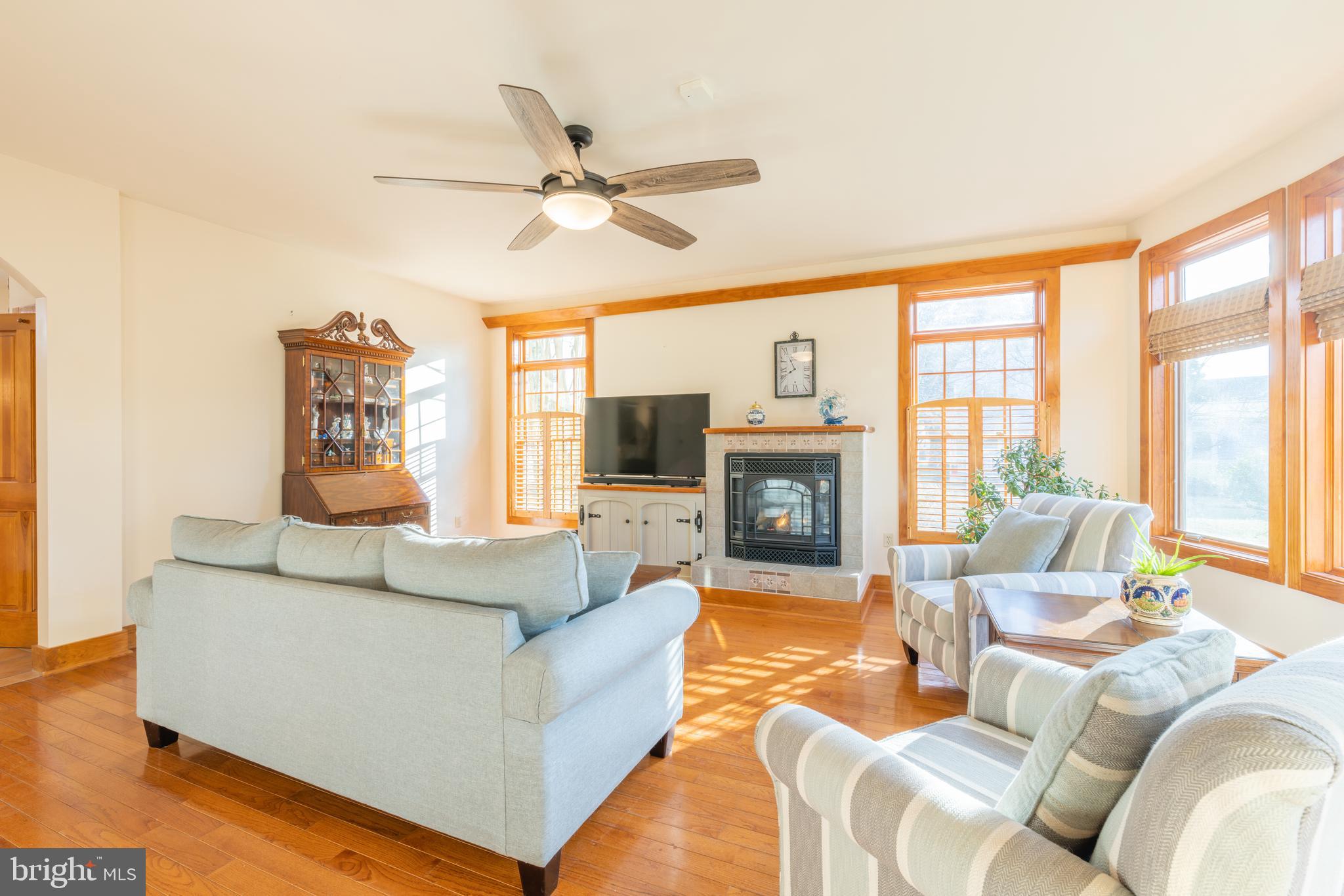 965 Curtis Road Solomons, MD 20629 - Photo 14 of 47 a living room with furniture fireplace and a large window