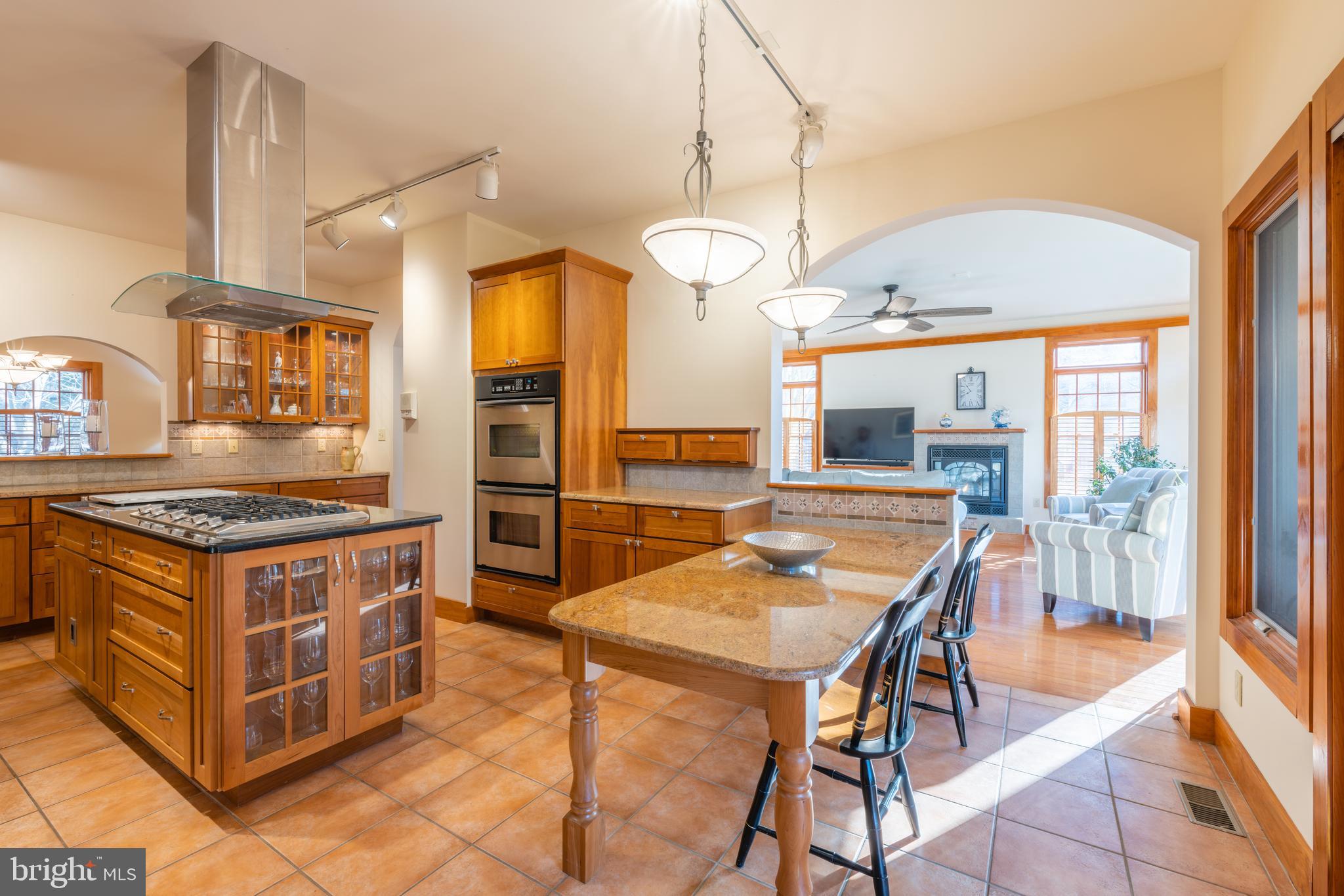 965 Curtis Road Solomons, MD 20629 - Photo 15 of 47 a kitchen with stainless steel appliances granite countertop a stove a sink and a refrigerator