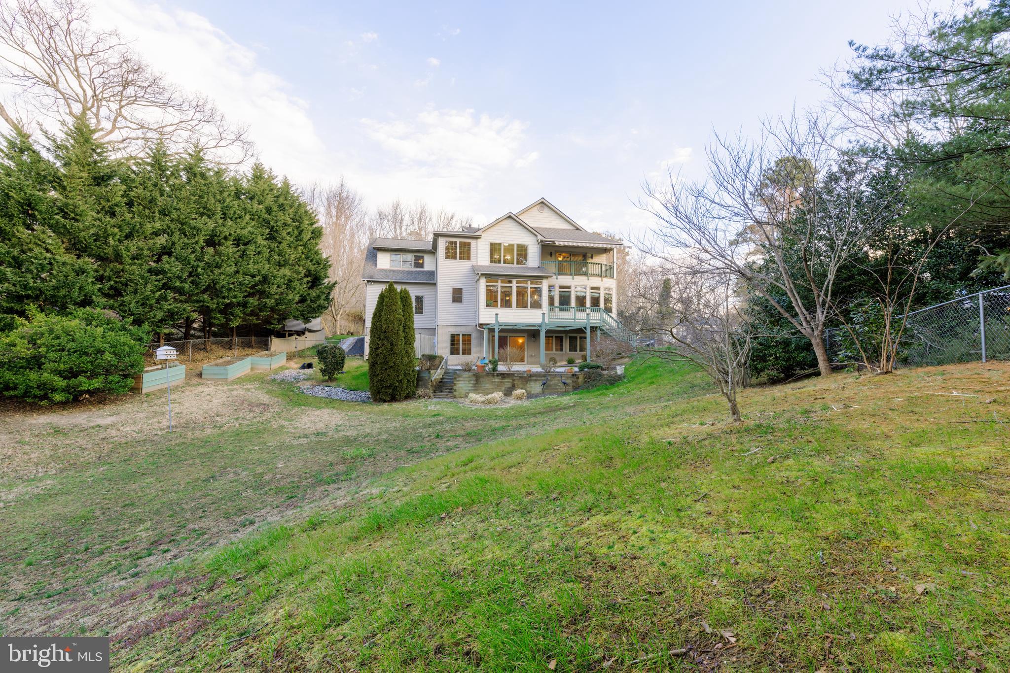 965 Curtis Road Solomons, MD 20629 - Photo 3 of 47 a view of a house with a yard and sitting area