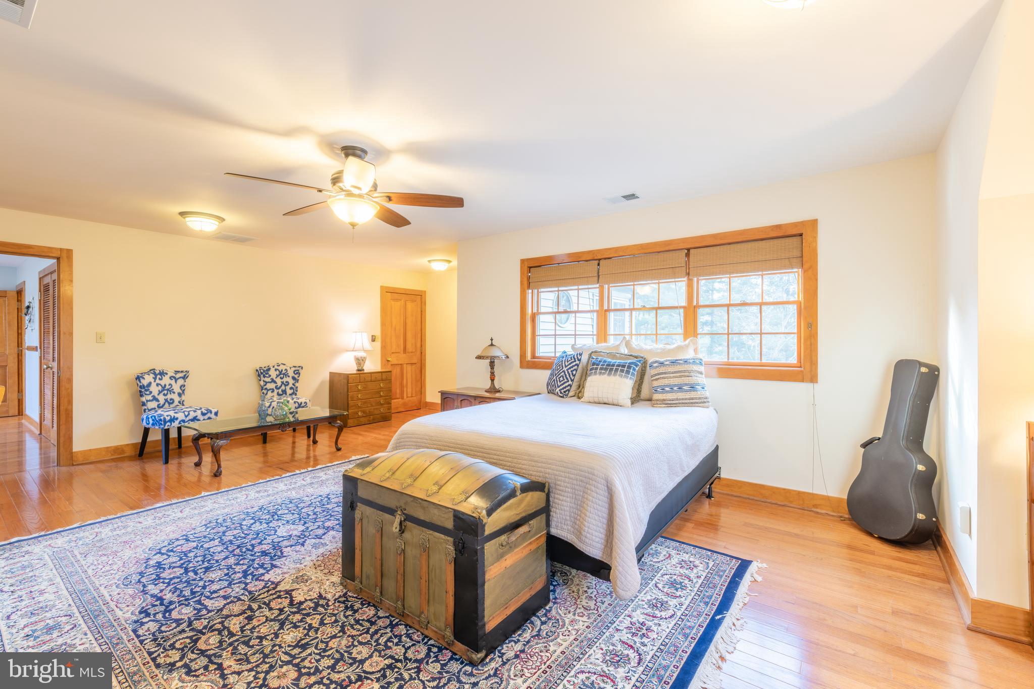 965 Curtis Road Solomons, MD 20629 - Photo 22 of 47 a bed room with a bed and a chair