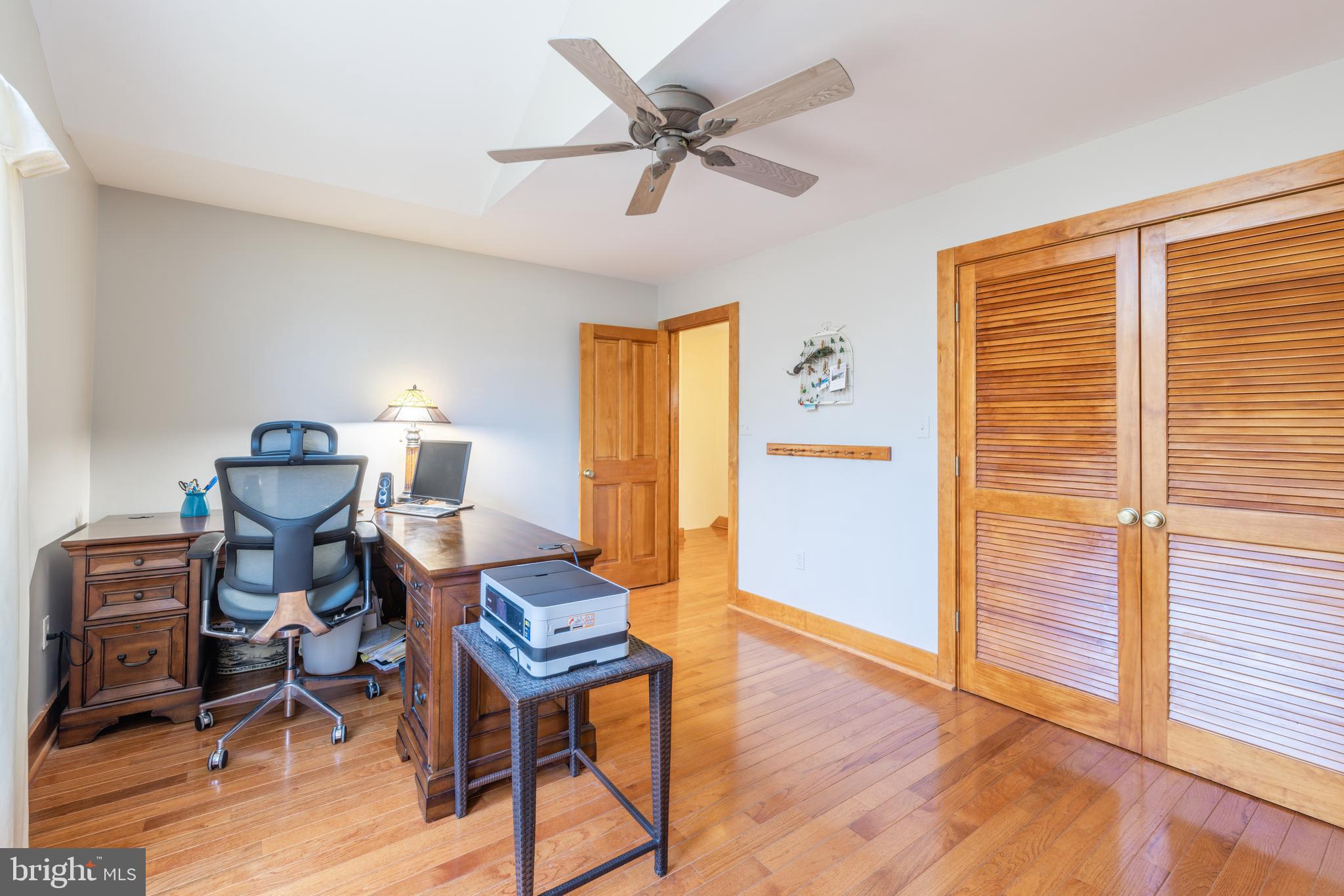 965 Curtis Road Solomons, MD 20629 - Photo 23 of 47 a workspace with wooden floor and a window