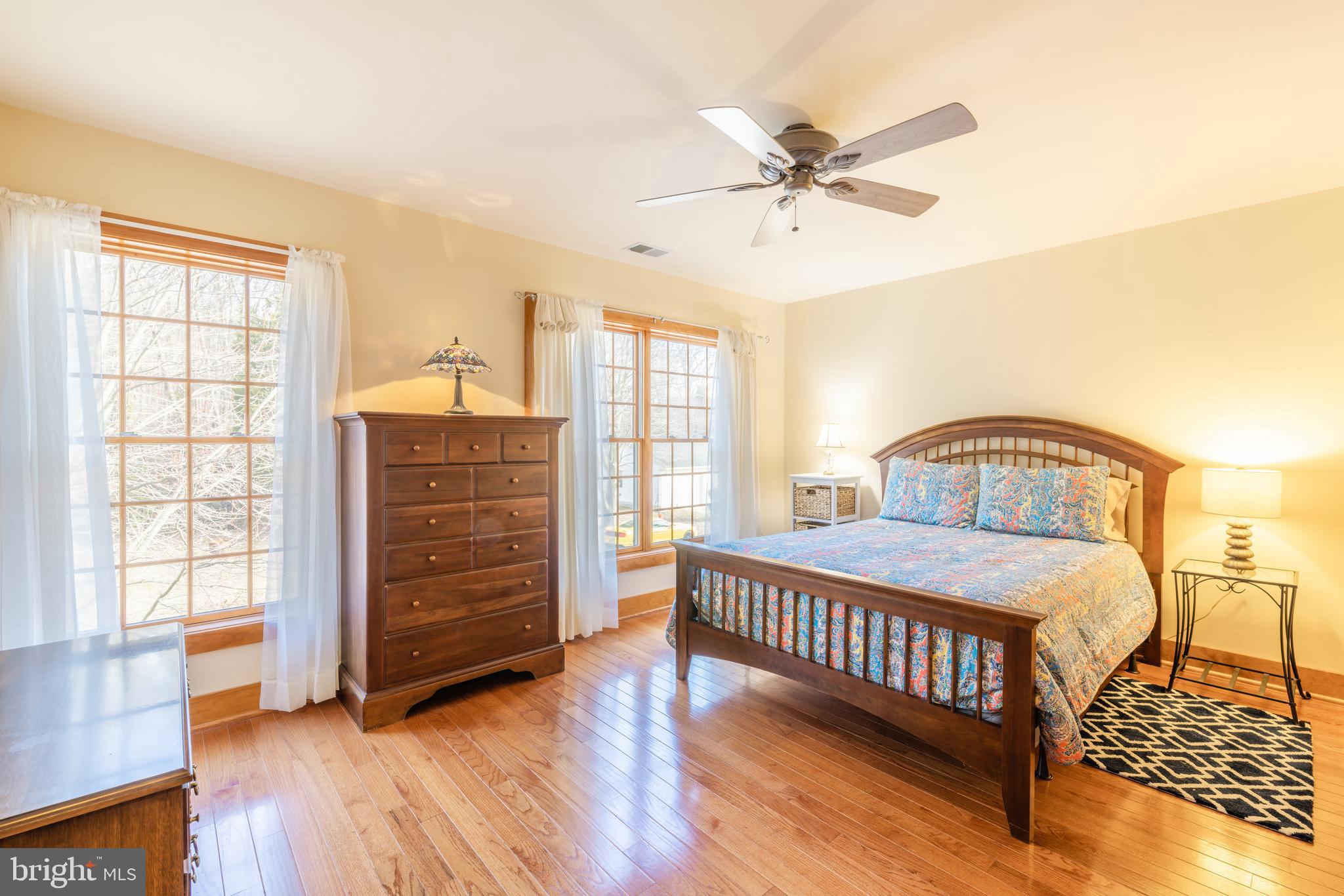 965 Curtis Road Solomons, MD 20629 - Photo 25 of 47 a bedroom with a bed and wooden floor