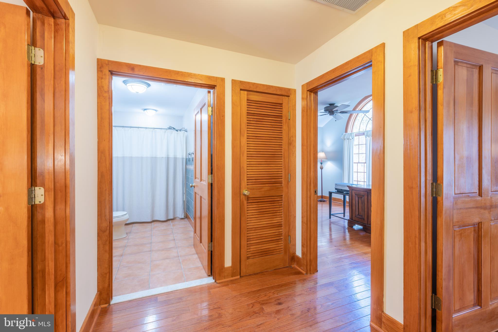 965 Curtis Road Solomons, MD 20629 - Photo 26 of 47 a view of a hallway with wooden floor and closet area