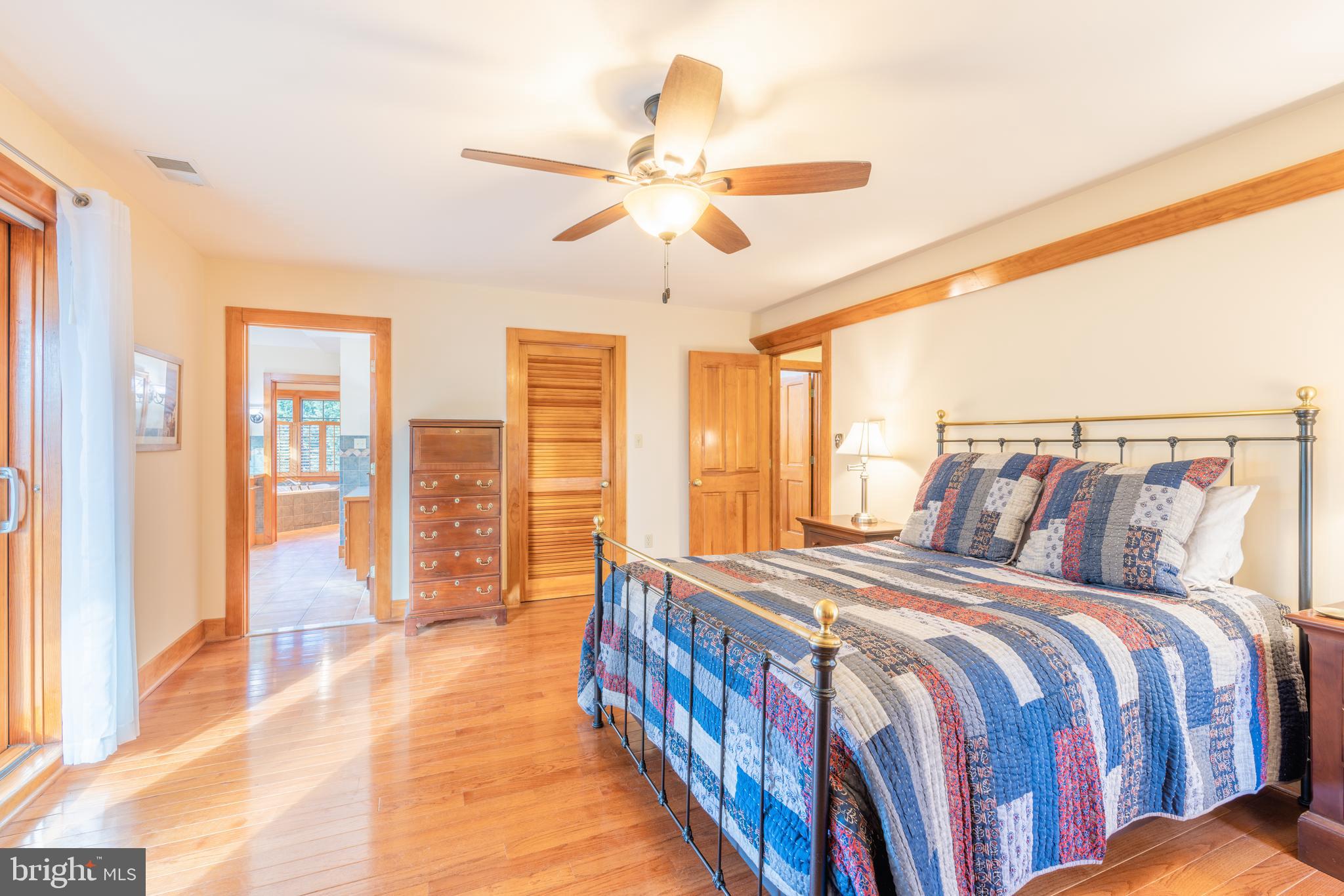 965 Curtis Road Solomons, MD 20629 - Photo 29 of 47 a bed room with a bed and a chandelier