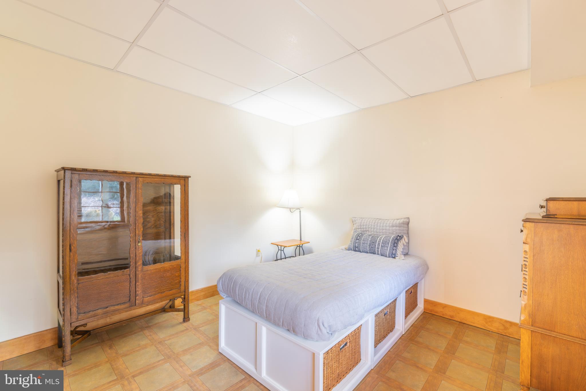 965 Curtis Road Solomons, MD 20629 - Photo 44 of 47 a room with a bed and a table in it