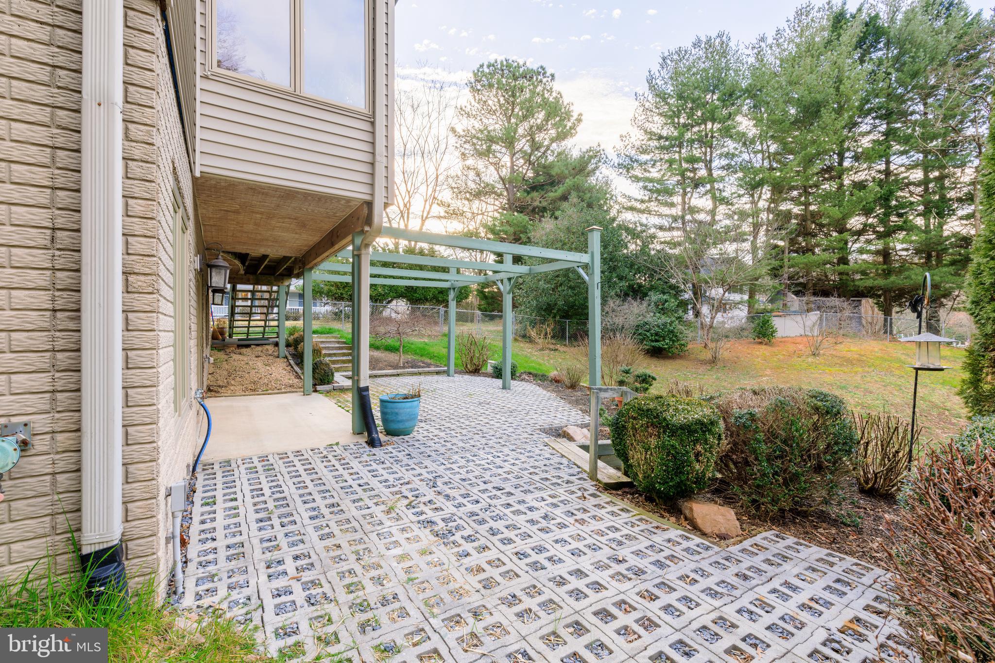 965 Curtis Road Solomons, MD 20629 - Photo 7 of 47 a view of a patio with table and chairs and potted plants